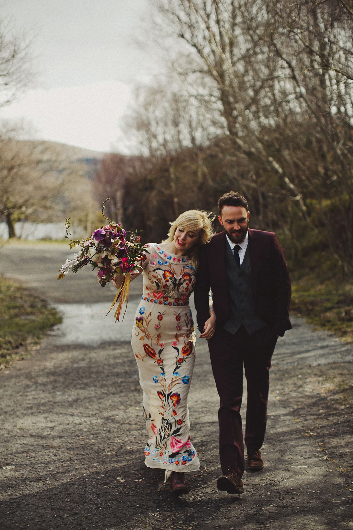 Gillian wore a colourful embroidered long sleeved gown by Temperley for her modern and alternative Woodside Warehouse wedding in Glasgow. Photography by Dan O'Day.