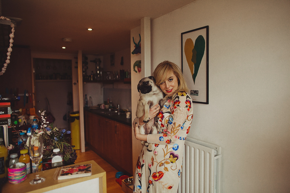 Gillian wore a colourful embroidered long sleeved gown by Temperley for her modern and alternative Woodside Warehouse wedding in Glasgow. Photography by Dan O'Day.