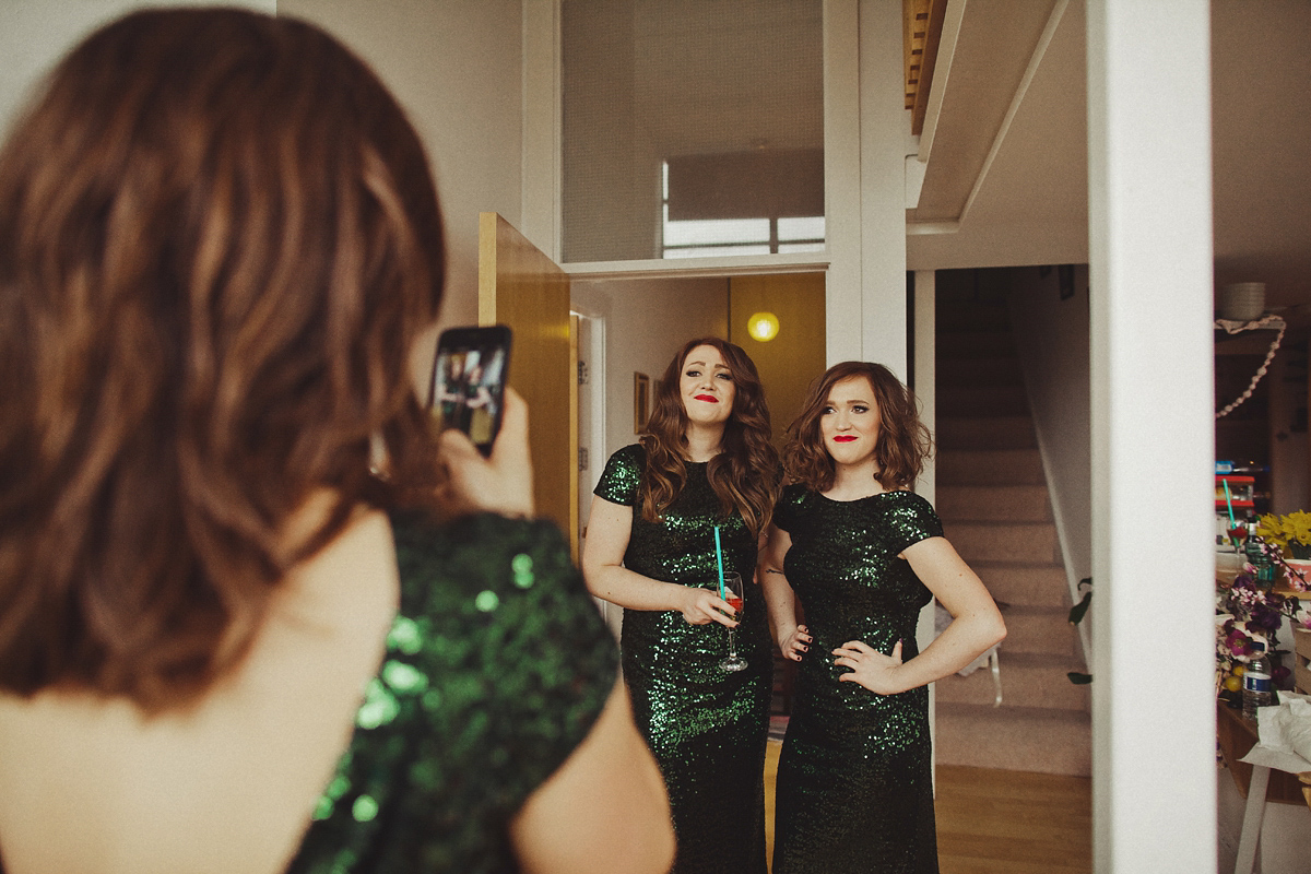 Gillian wore a colourful embroidered long sleeved gown by Temperley for her modern and alternative Woodside Warehouse wedding in Glasgow. Photography by Dan O'Day.