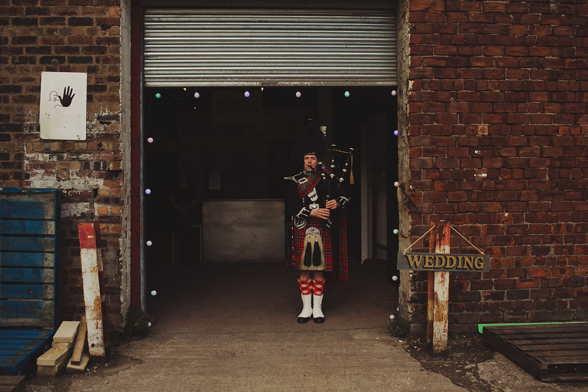 Gillian wore a colourful embroidered long sleeved gown by Temperley for her modern and alternative Woodside Warehouse wedding in Glasgow. Photography by Dan O'Day.