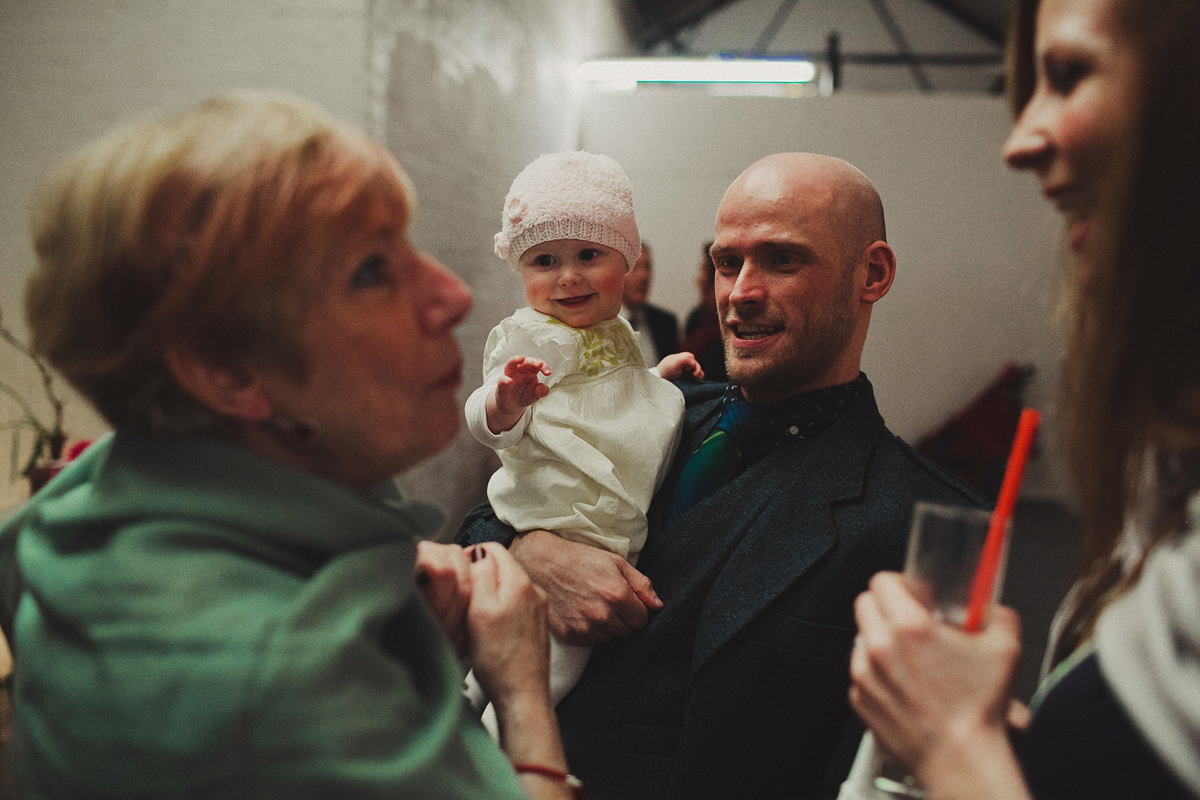 Gillian wore a colourful embroidered long sleeved gown by Temperley for her modern and alternative Woodside Warehouse wedding in Glasgow. Photography by Dan O'Day.