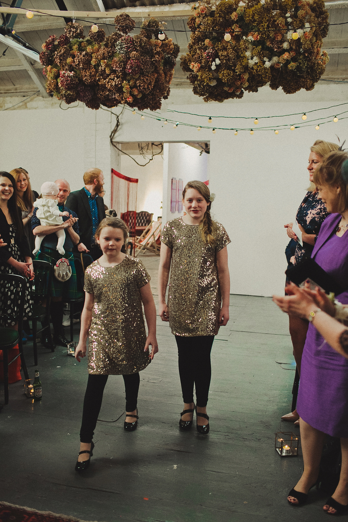 Gillian wore a colourful embroidered long sleeved gown by Temperley for her modern and alternative Woodside Warehouse wedding in Glasgow. Photography by Dan O'Day.