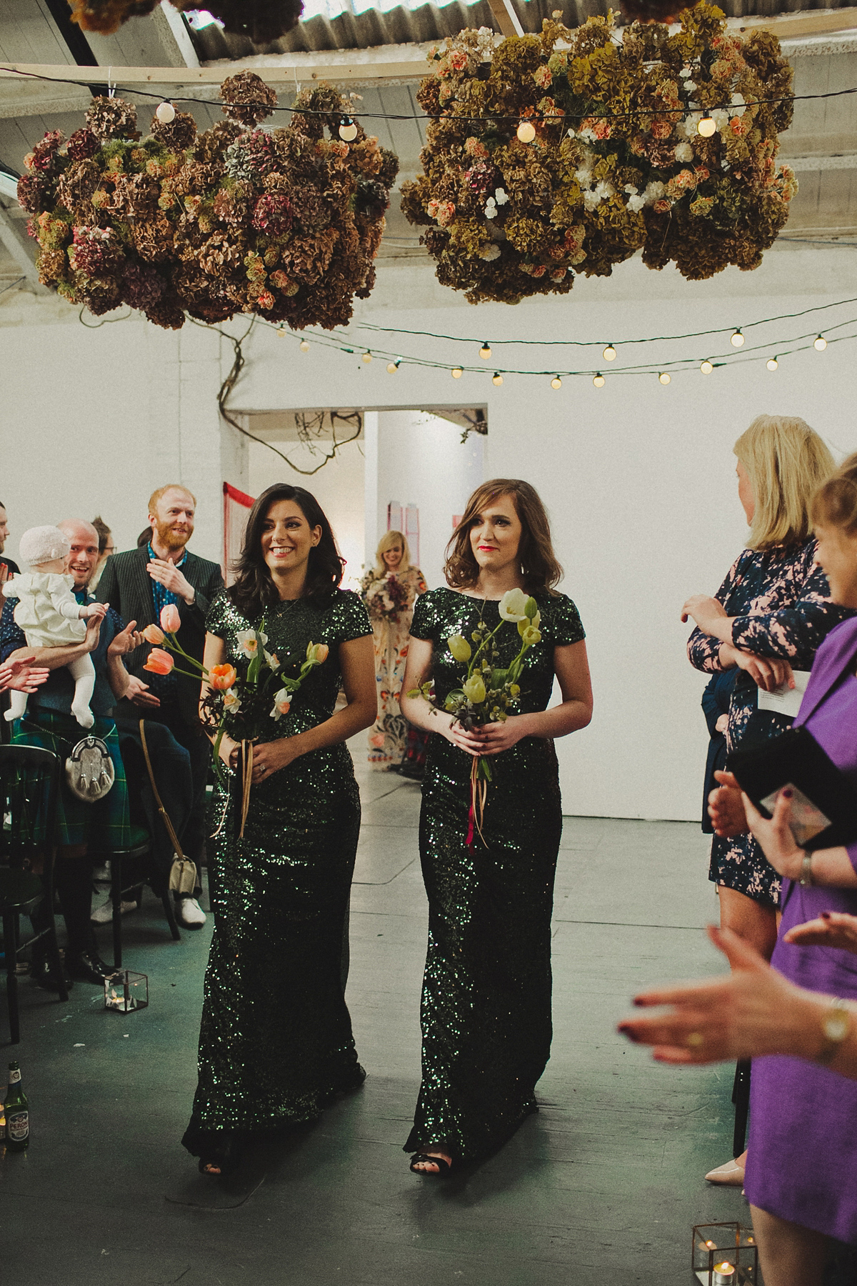 Gillian wore a colourful embroidered long sleeved gown by Temperley for her modern and alternative Woodside Warehouse wedding in Glasgow. Photography by Dan O'Day.