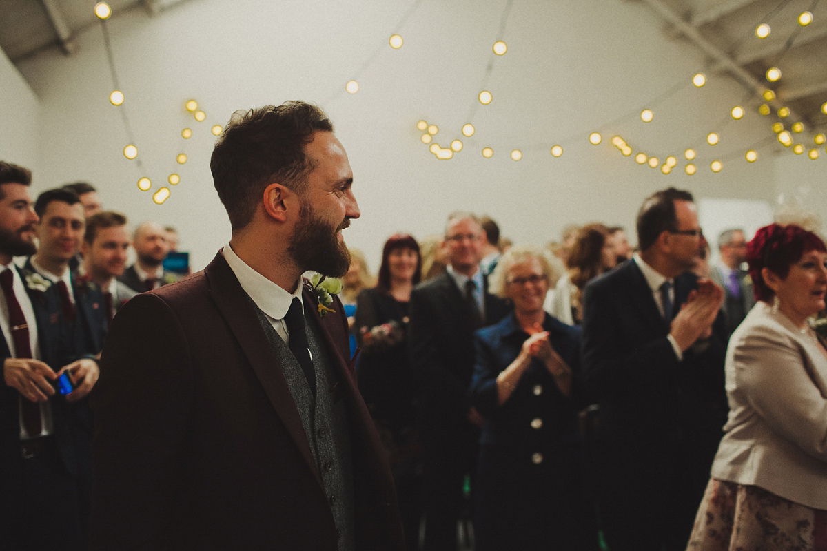 Gillian wore a colourful embroidered long sleeved gown by Temperley for her modern and alternative Woodside Warehouse wedding in Glasgow. Photography by Dan O'Day.