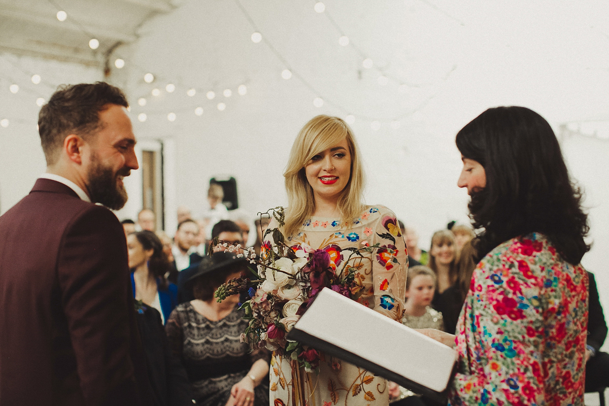 Gillian wore a colourful embroidered long sleeved gown by Temperley for her modern and alternative Woodside Warehouse wedding in Glasgow. Photography by Dan O'Day.