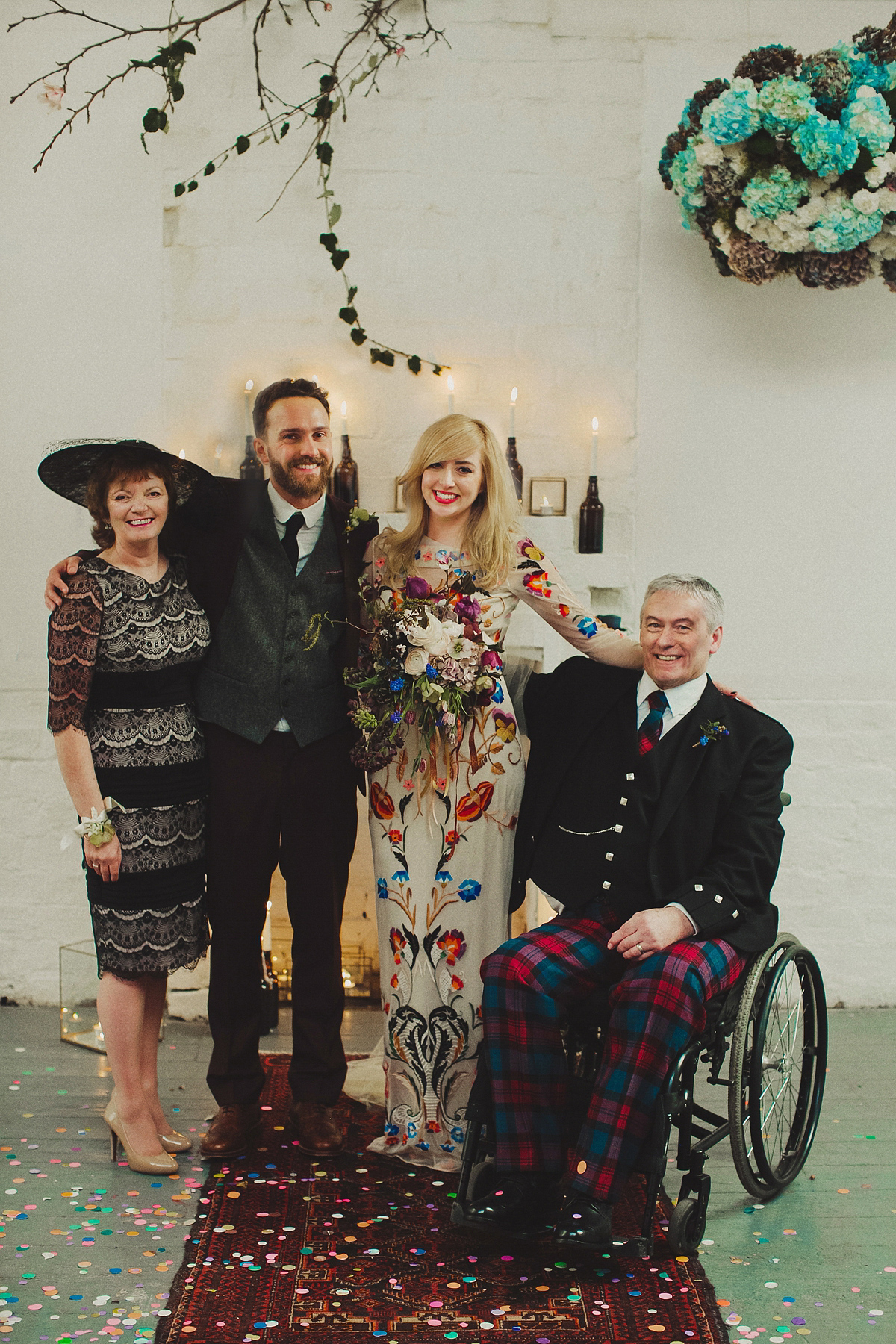 Gillian wore a colourful embroidered long sleeved gown by Temperley for her modern and alternative Woodside Warehouse wedding in Glasgow. Photography by Dan O'Day.