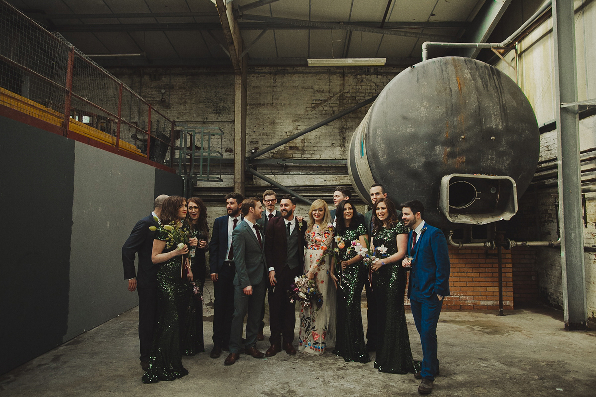 Gillian wore a colourful embroidered long sleeved gown by Temperley for her modern and alternative Woodside Warehouse wedding in Glasgow. Photography by Dan O'Day.