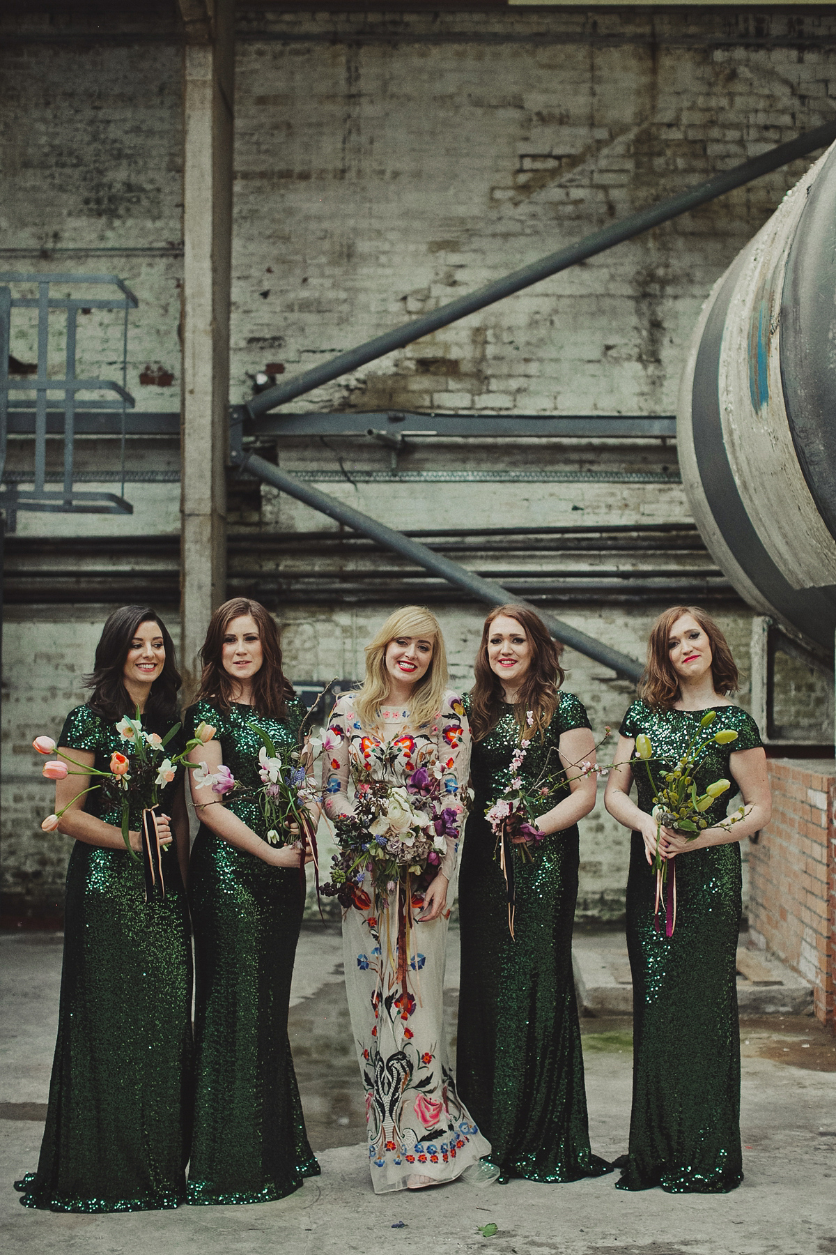 Gillian wore a colourful embroidered long sleeved gown by Temperley for her modern and alternative Woodside Warehouse wedding in Glasgow. Photography by Dan O'Day.