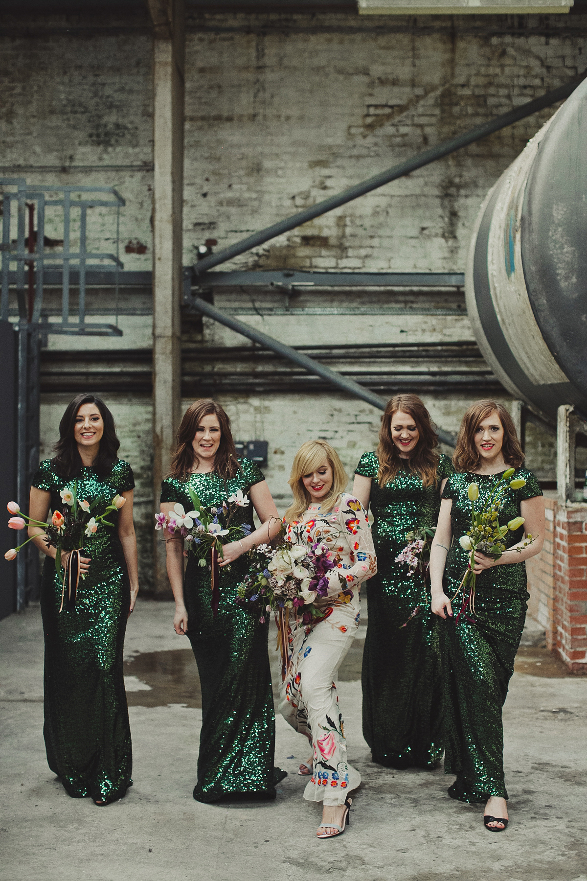 Gillian wore a colourful embroidered long sleeved gown by Temperley for her modern and alternative Woodside Warehouse wedding in Glasgow. Photography by Dan O'Day.