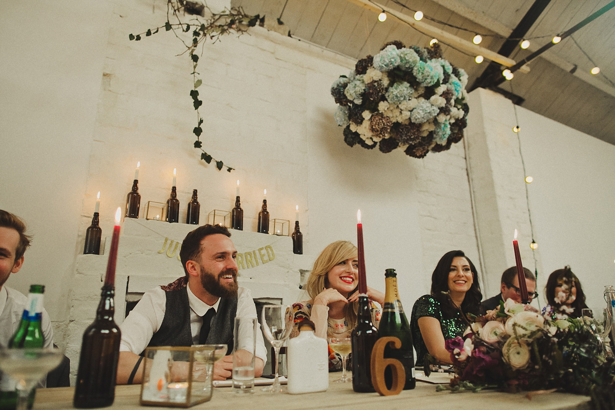 Gillian wore a colourful embroidered long sleeved gown by Temperley for her modern and alternative Woodside Warehouse wedding in Glasgow. Photography by Dan O'Day.