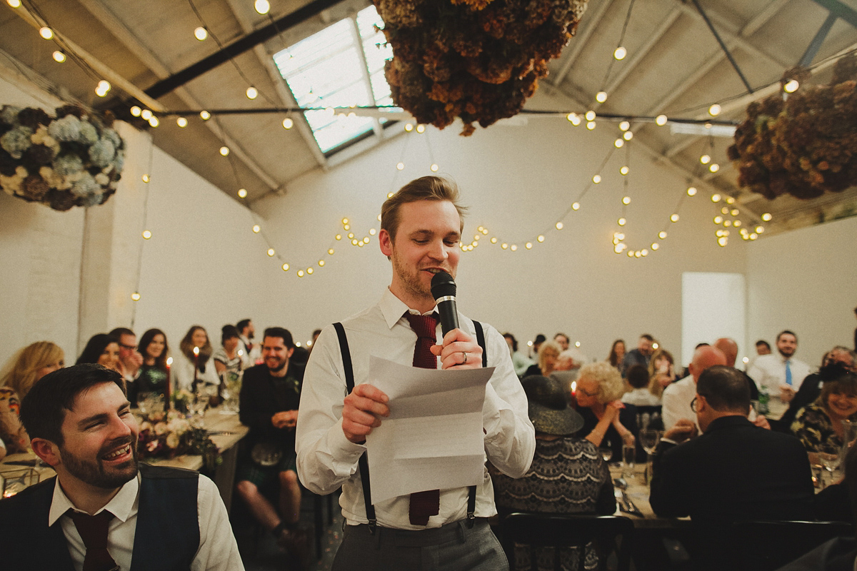 Gillian wore a colourful embroidered long sleeved gown by Temperley for her modern and alternative Woodside Warehouse wedding in Glasgow. Photography by Dan O'Day.