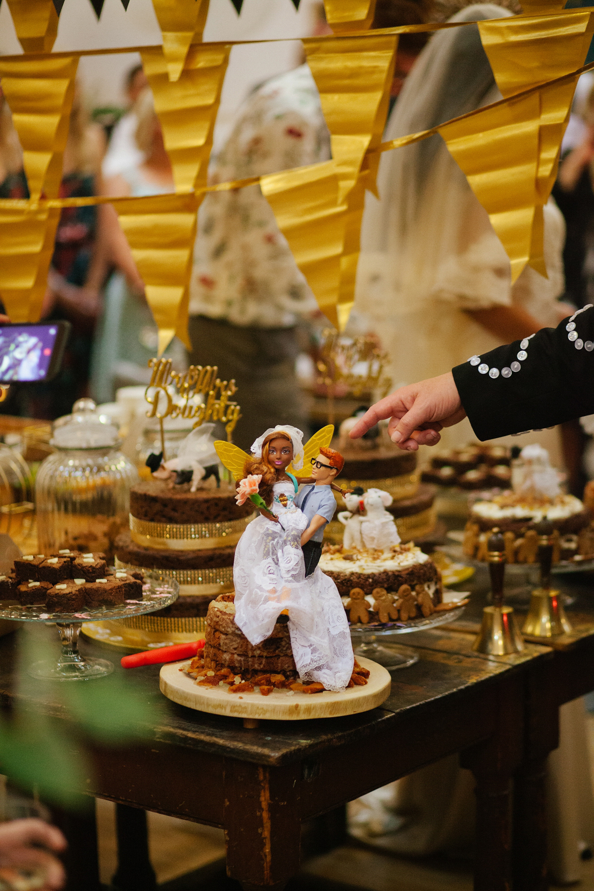 Bianca wore a Catherine Deane gown for her kitsch, cool and disco inspired London wedding. Photography by Emma Case.