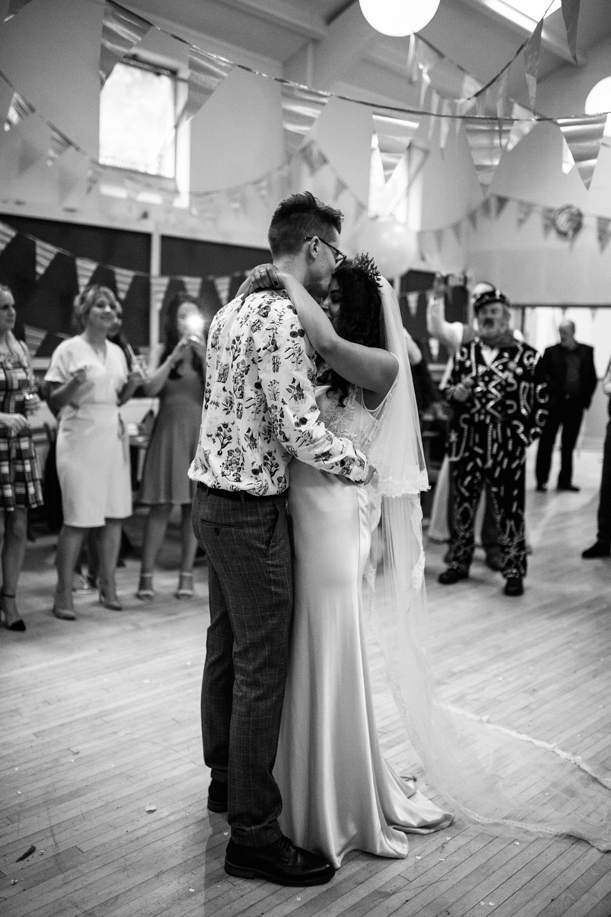 Bianca wore a Catherine Deane gown for her kitsch, cool and disco inspired London wedding. Photography by Emma Case.