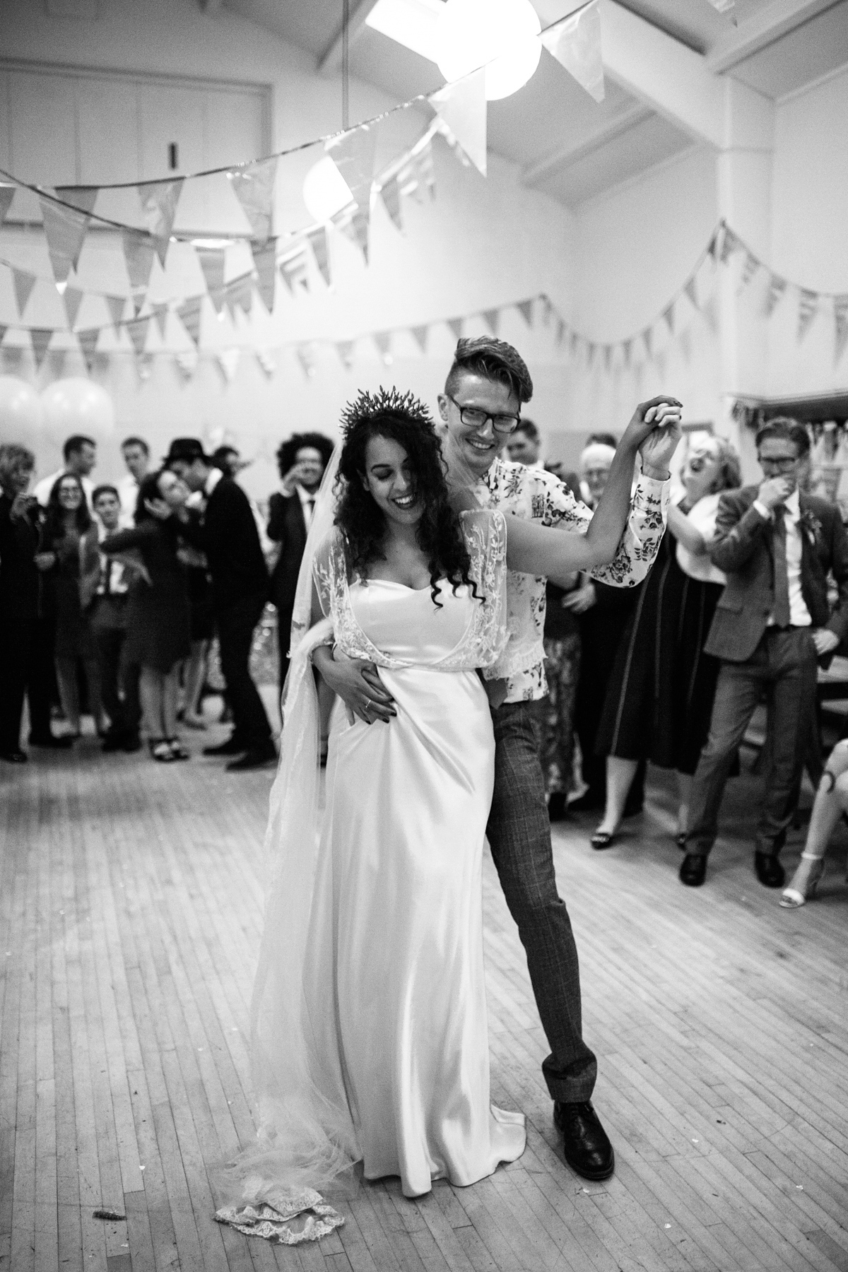 Bianca wore a Catherine Deane gown for her kitsch, cool and disco inspired London wedding. Photography by Emma Case.