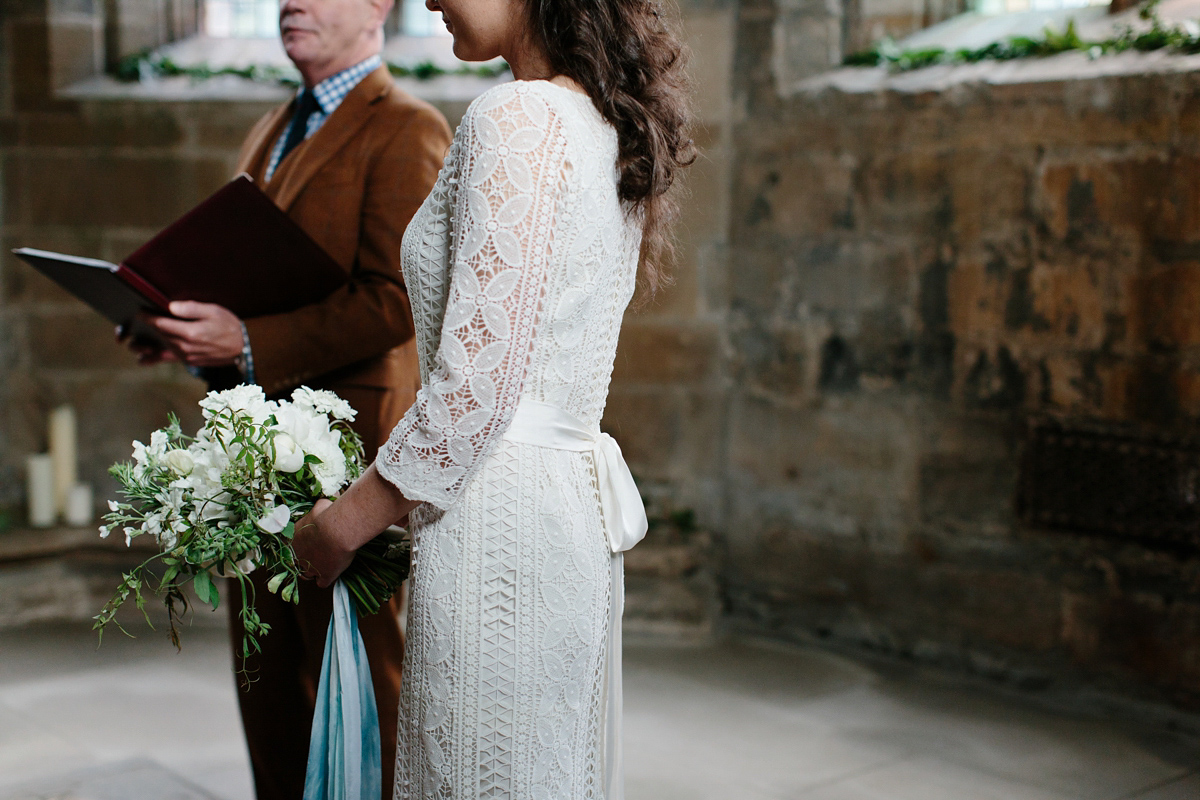 Rosa wore a boho dress by eco-bridal fashion label Minna for her vegetarian feast, secret herb garden wedding. Photography by Caro Weiss.