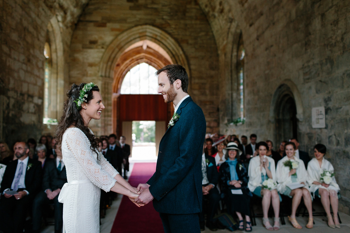 Rosa wore a boho dress by eco-bridal fashion label Minna for her vegetarian feast, secret herb garden wedding. Photography by Caro Weiss.