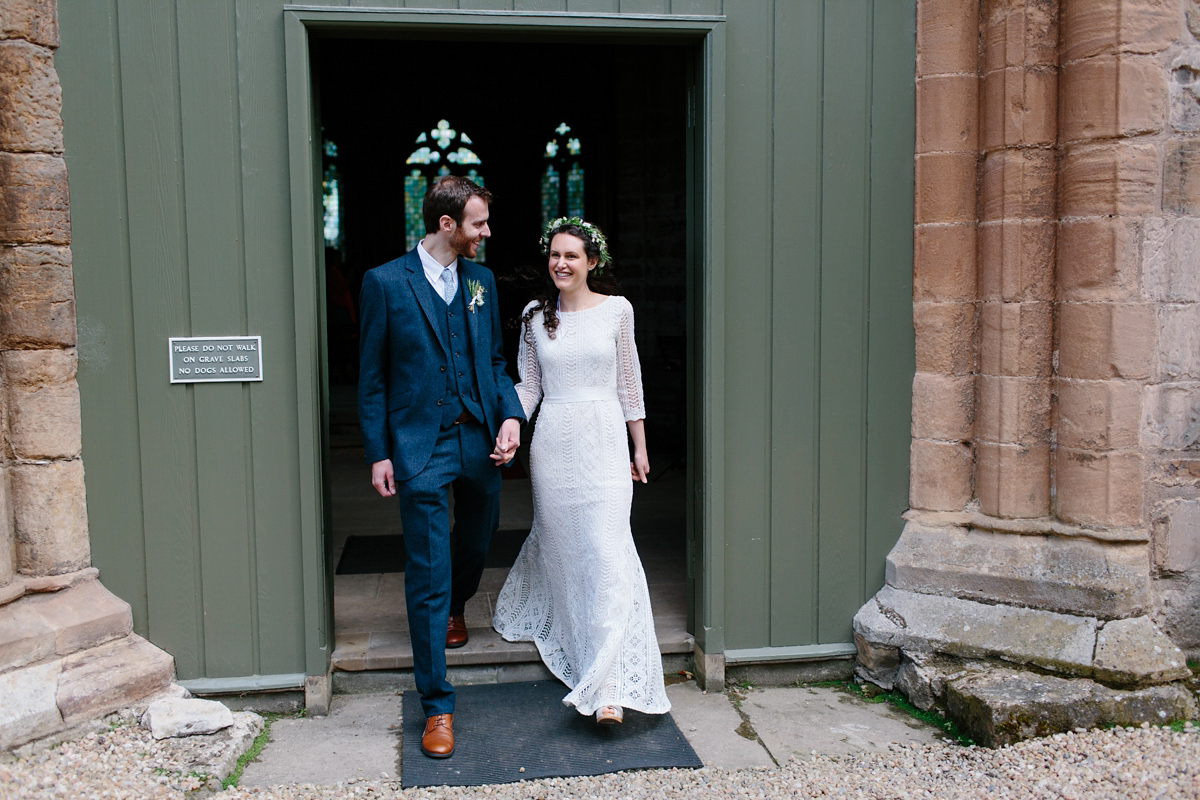 Rosa wore a boho dress by eco-bridal fashion label Minna for her vegetarian feast, secret herb garden wedding. Photography by Caro Weiss.