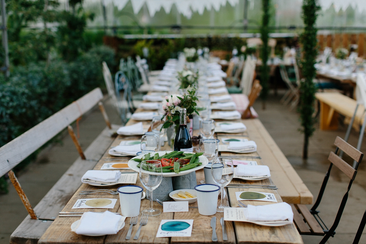 Rosa wore a boho dress by eco-bridal fashion label Minna for her vegetarian feast, secret herb garden wedding. Photography by Caro Weiss.