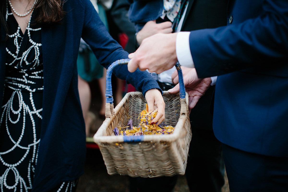 Rosa wore a boho dress by eco-bridal fashion label Minna for her vegetarian feast, secret herb garden wedding. Photography by Caro Weiss.