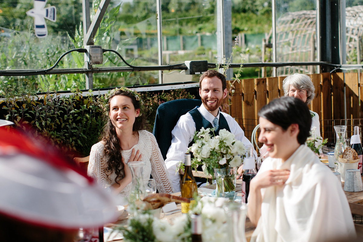 Rosa wore a boho dress by eco-bridal fashion label Minna for her vegetarian feast, secret herb garden wedding. Photography by Caro Weiss.