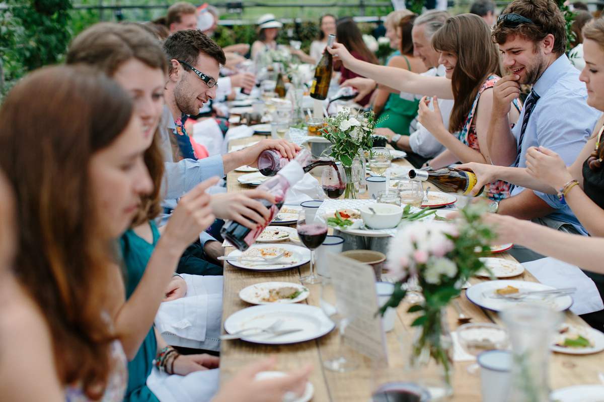 Rosa wore a boho dress by eco-bridal fashion label Minna for her vegetarian feast, secret herb garden wedding. Photography by Caro Weiss.