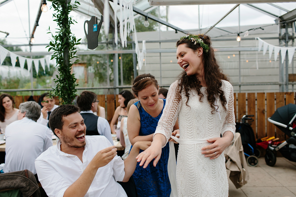 Rosa wore a boho dress by eco-bridal fashion label Minna for her vegetarian feast, secret herb garden wedding. Photography by Caro Weiss.