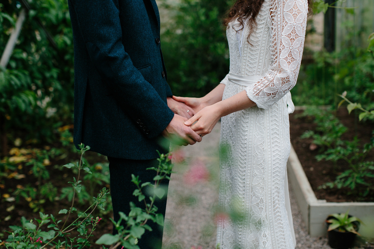 Rosa wore a boho dress by eco-bridal fashion label Minna for her vegetarian feast, secret herb garden wedding. Photography by Caro Weiss.