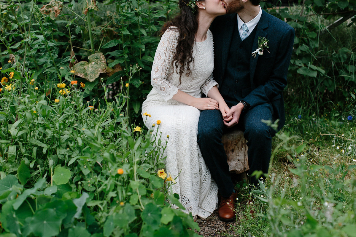 Rosa wore a boho dress by eco-bridal fashion label Minna for her vegetarian feast, secret herb garden wedding. Photography by Caro Weiss.