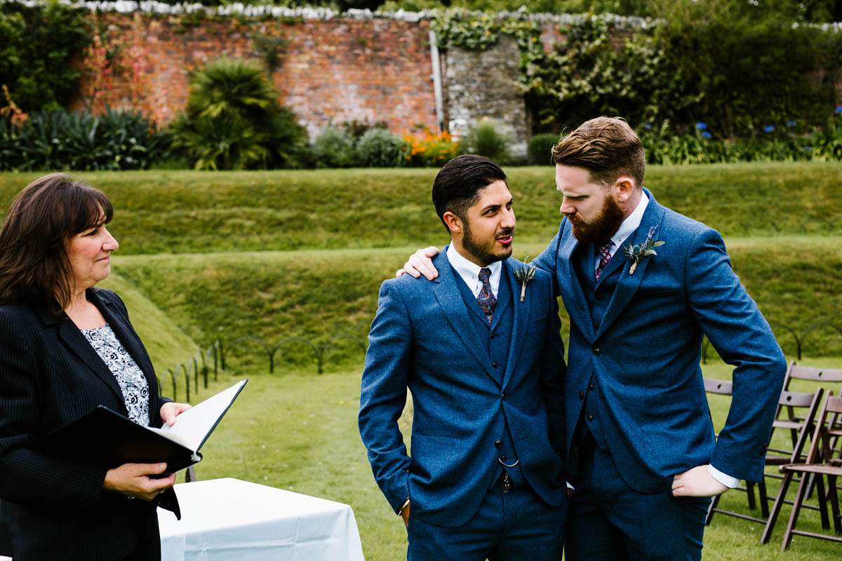 Kirsty wore a Rue de Seine gown from Leonie C. Bridal boutique in Brighton. Her handmade, Summer wedding took place in a Game of Thrones venue in Downpatrick. It was filled with floral chandeliers. Photography by Honey and the Moon.