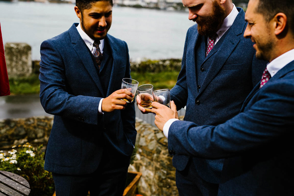 Kirsty wore a Rue de Seine gown from Leonie C. Bridal boutique in Brighton. Her handmade, Summer wedding took place in a Game of Thrones venue in Downpatrick. It was filled with floral chandeliers. Photography by Honey and the Moon.