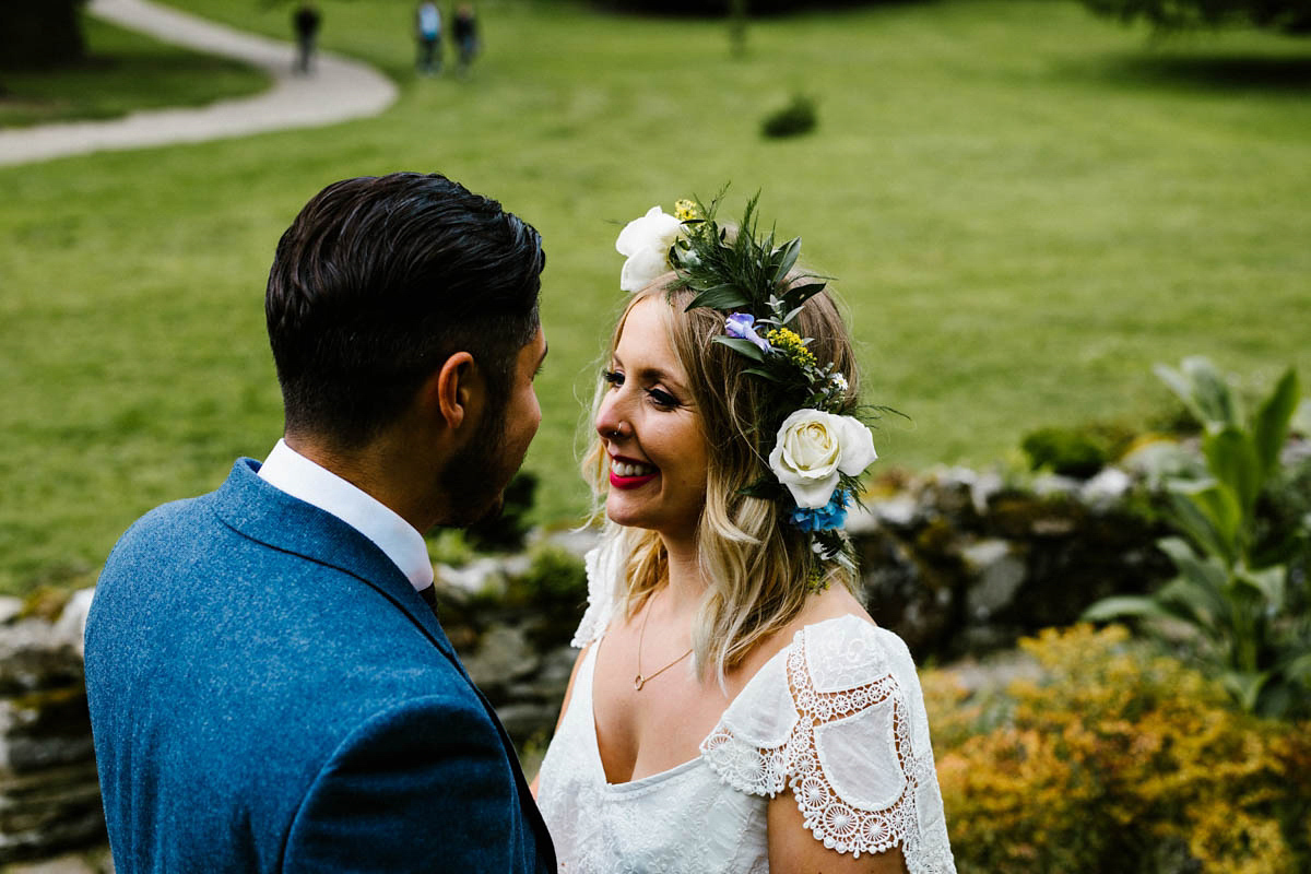 Kirsty wore a Rue de Seine gown from Leonie C. Bridal boutique in Brighton. Her handmade, Summer wedding took place in a Game of Thrones venue in Downpatrick. It was filled with floral chandeliers. Photography by Honey and the Moon.