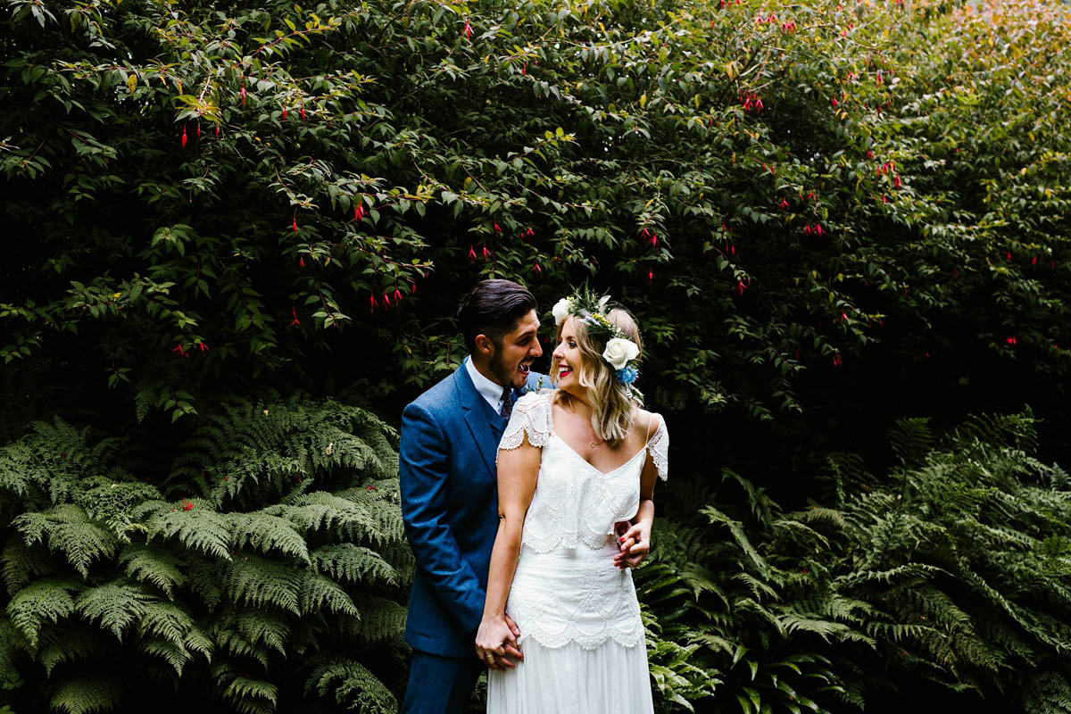 Kirsty wore a Rue de Seine gown from Leonie C. Bridal boutique in Brighton. Her handmade, Summer wedding took place in a Game of Thrones venue in Downpatrick. It was filled with floral chandeliers. Photography by Honey and the Moon.