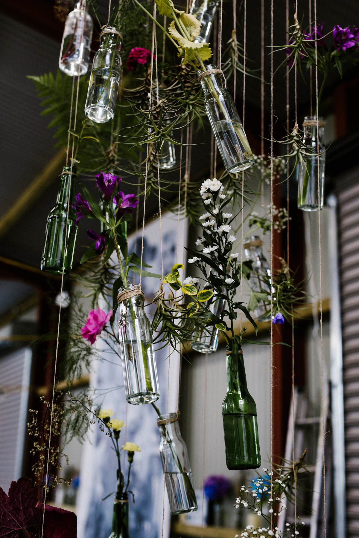 Kirsty wore a Rue de Seine gown from Leonie C. Bridal boutique in Brighton. Her handmade, Summer wedding took place in a Game of Thrones venue in Downpatrick. It was filled with floral chandeliers. Photography by Honey and the Moon.