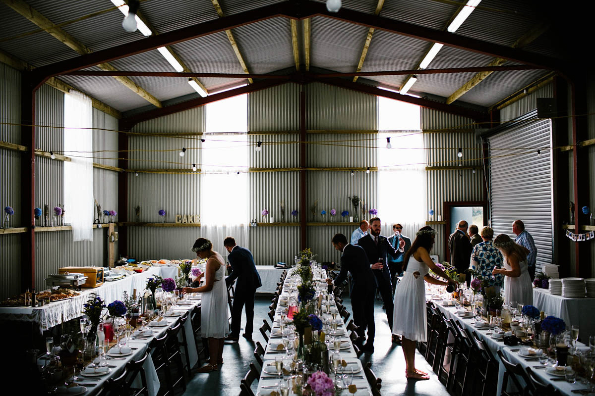 Kirsty wore a Rue de Seine gown from Leonie C. Bridal boutique in Brighton. Her handmade, Summer wedding took place in a Game of Thrones venue in Downpatrick. It was filled with floral chandeliers. Photography by Honey and the Moon.