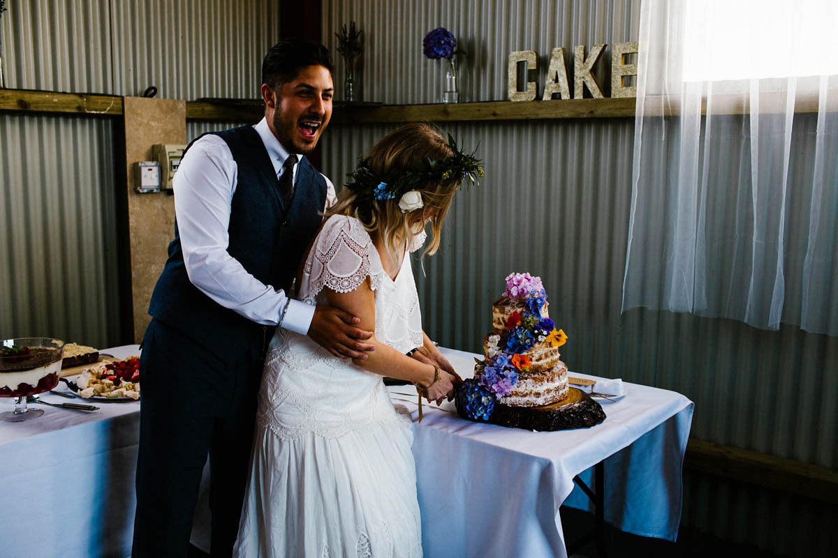 Kirsty wore a Rue de Seine gown from Leonie C. Bridal boutique in Brighton. Her handmade, Summer wedding took place in a Game of Thrones venue in Downpatrick. It was filled with floral chandeliers. Photography by Honey and the Moon.