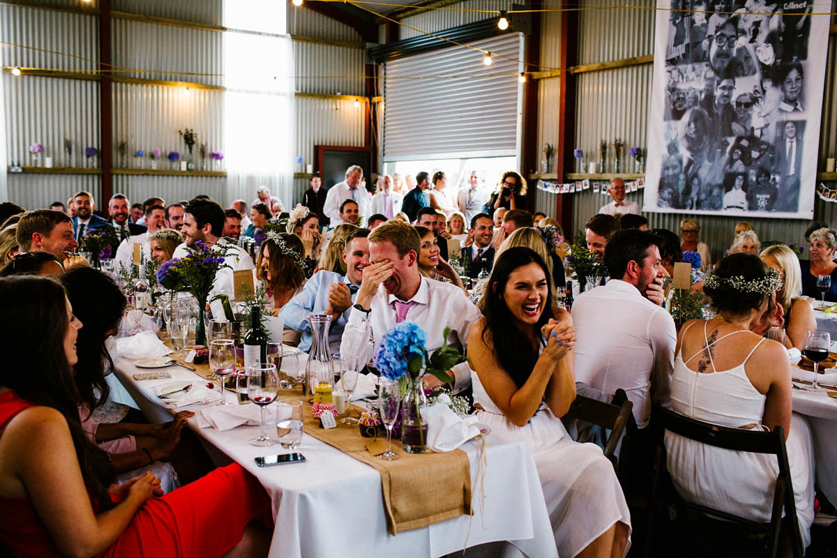 Kirsty wore a Rue de Seine gown from Leonie C. Bridal boutique in Brighton. Her handmade, Summer wedding took place in a Game of Thrones venue in Downpatrick. It was filled with floral chandeliers. Photography by Honey and the Moon.