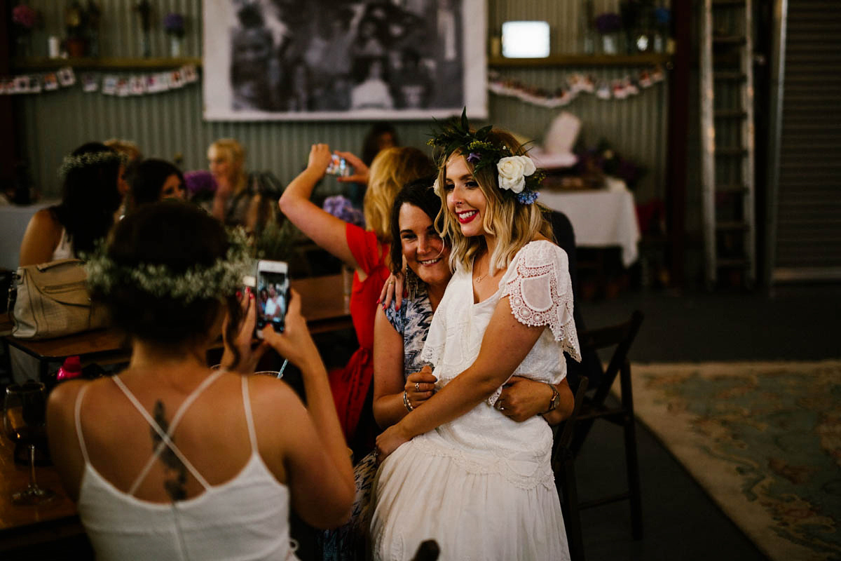 Kirsty wore a Rue de Seine gown from Leonie C. Bridal boutique in Brighton. Her handmade, Summer wedding took place in a Game of Thrones venue in Downpatrick. It was filled with floral chandeliers. Photography by Honey and the Moon.