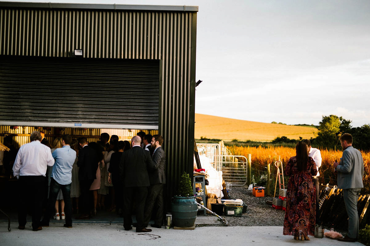 Kirsty wore a Rue de Seine gown from Leonie C. Bridal boutique in Brighton. Her handmade, Summer wedding took place in a Game of Thrones venue in Downpatrick. It was filled with floral chandeliers. Photography by Honey and the Moon.