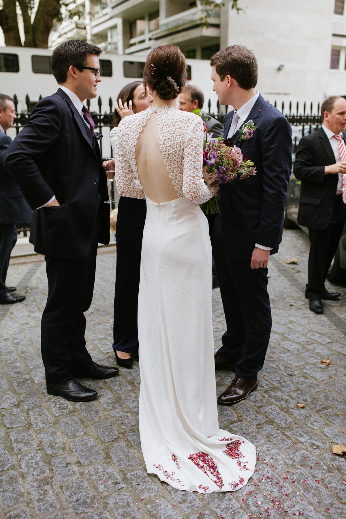 Faye wore a long sleeved, backless Self Portrait dress for her fuss-free, chic and modern wedding at the ICA in London. Photography by Emma Case.