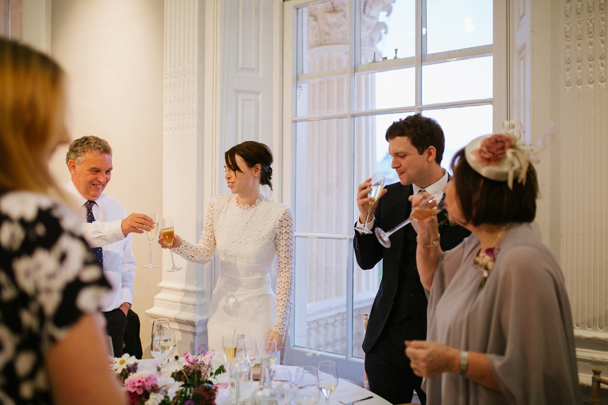 Faye wore a long sleeved, backless Self Portrait dress for her fuss-free, chic and modern wedding at the ICA in London. Photography by Emma Case.