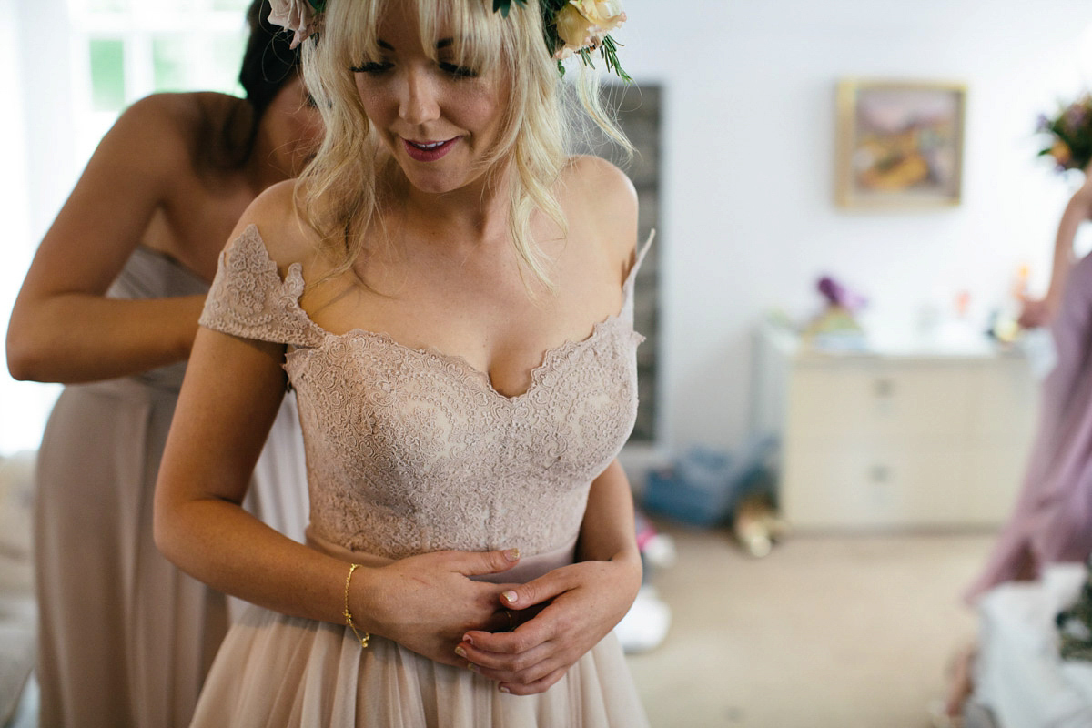 Jillian wore a dusky pink 2-piece dress by Watters for her romantic outdoor wedding ceremony in Scotland. Captured by MIrrorbox Photography.