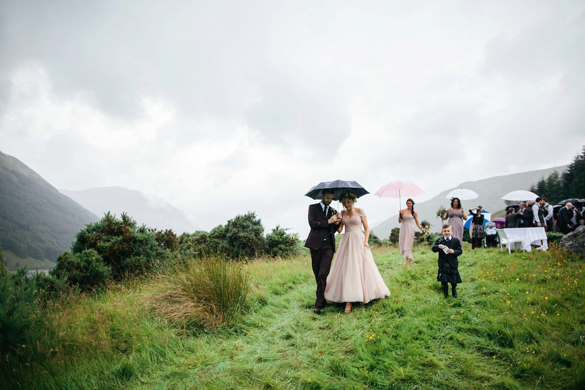 Jillian wore a dusky pink 2-piece dress by Watters for her romantic outdoor wedding ceremony in Scotland. Captured by MIrrorbox Photography.