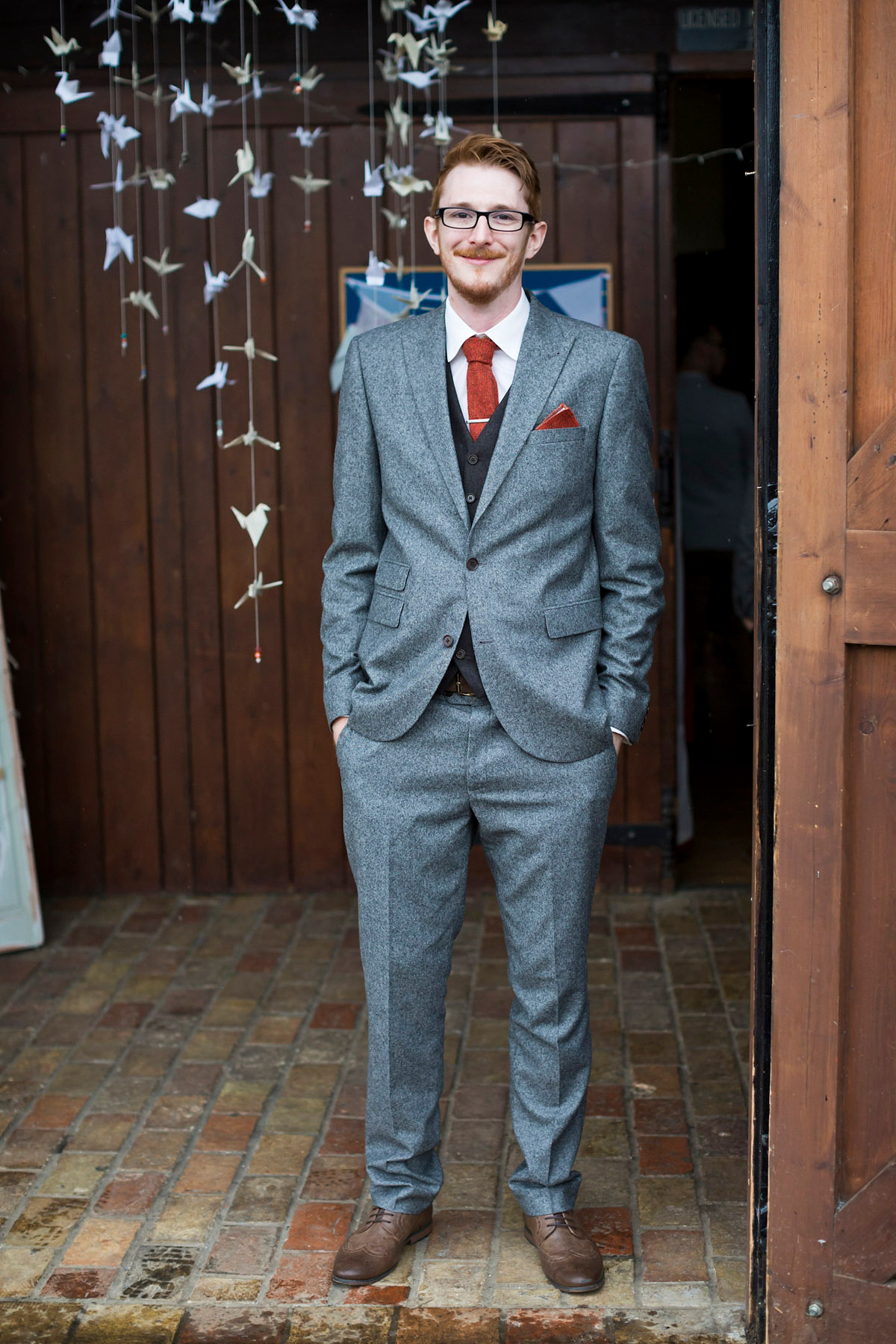 Etsy illustrator Kerris wore an ASOS wedding dress for her boho and handmade village hall wedding. We love the comic book confetti! Photography by Mark Tattersall.