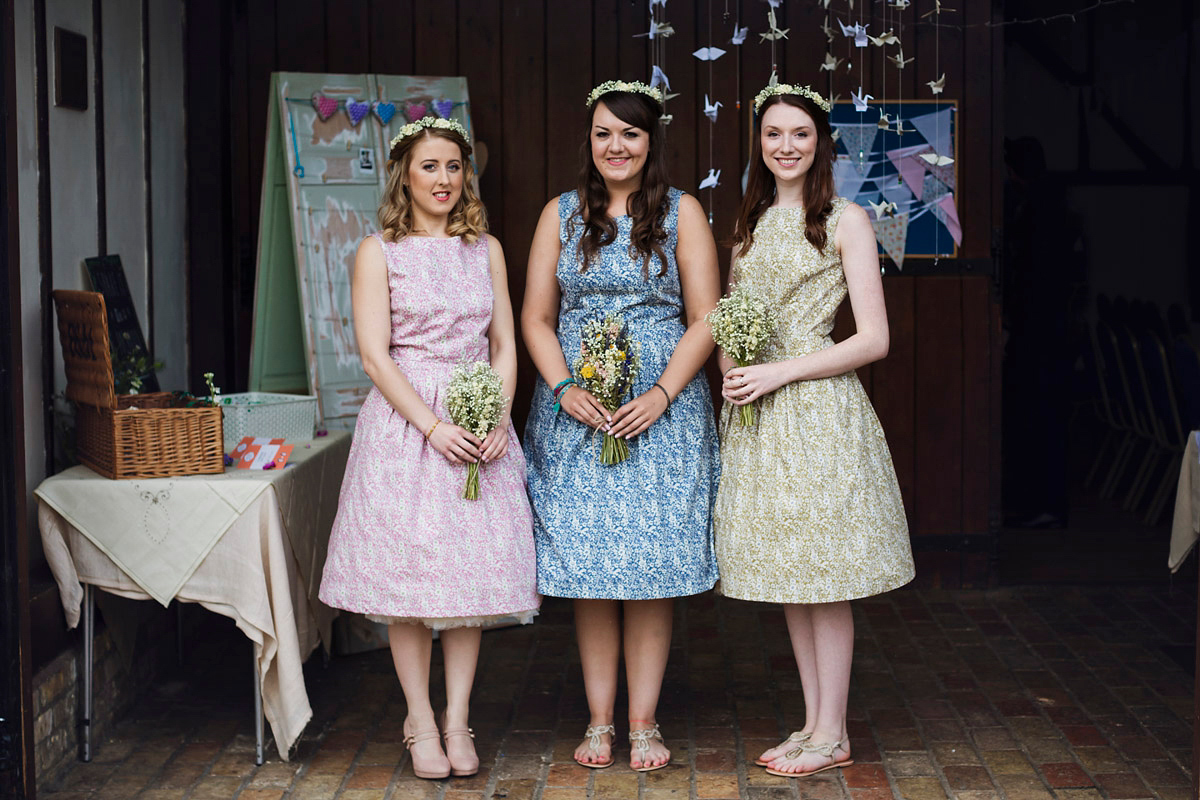 Etsy illustrator Kerris wore an ASOS wedding dress for her boho and handmade village hall wedding. We love the comic book confetti! Photography by Mark Tattersall.