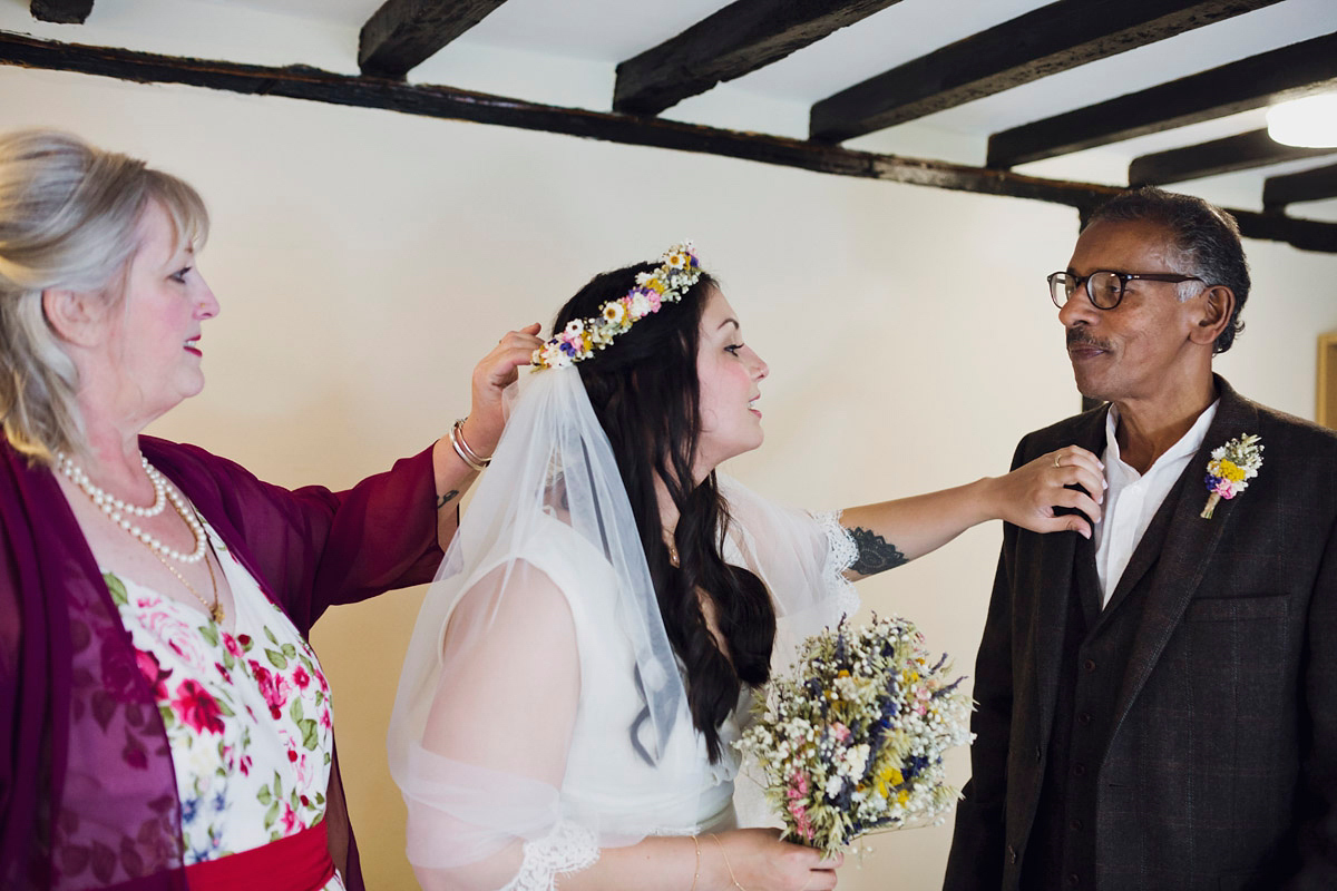 Etsy illustrator Kerris wore an ASOS wedding dress for her boho and handmade village hall wedding. We love the comic book confetti! Photography by Mark Tattersall.