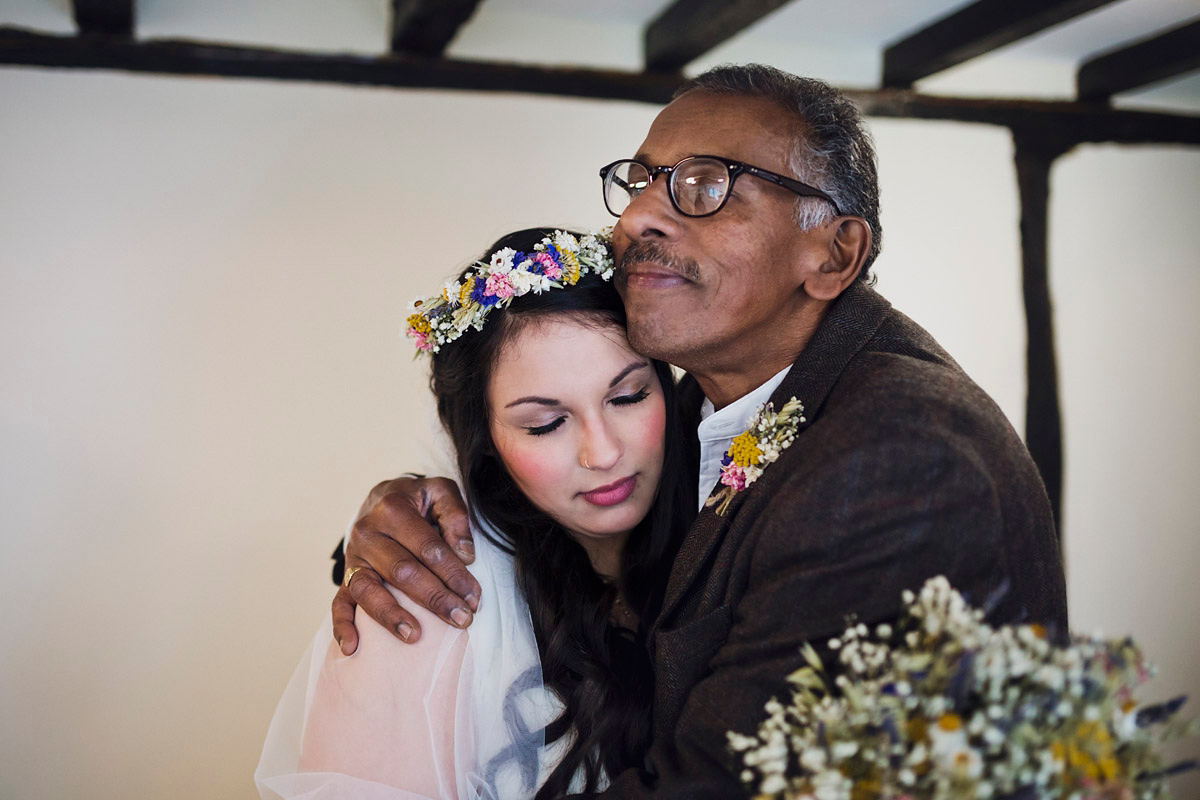 Etsy illustrator Kerris wore an ASOS wedding dress for her boho and handmade village hall wedding. We love the comic book confetti! Photography by Mark Tattersall.