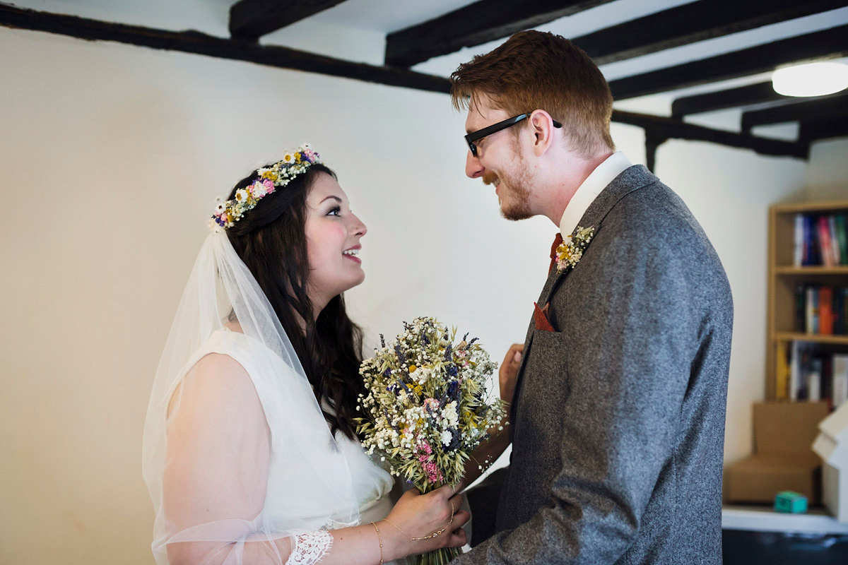 Etsy illustrator Kerris wore an ASOS wedding dress for her boho and handmade village hall wedding. We love the comic book confetti! Photography by Mark Tattersall.