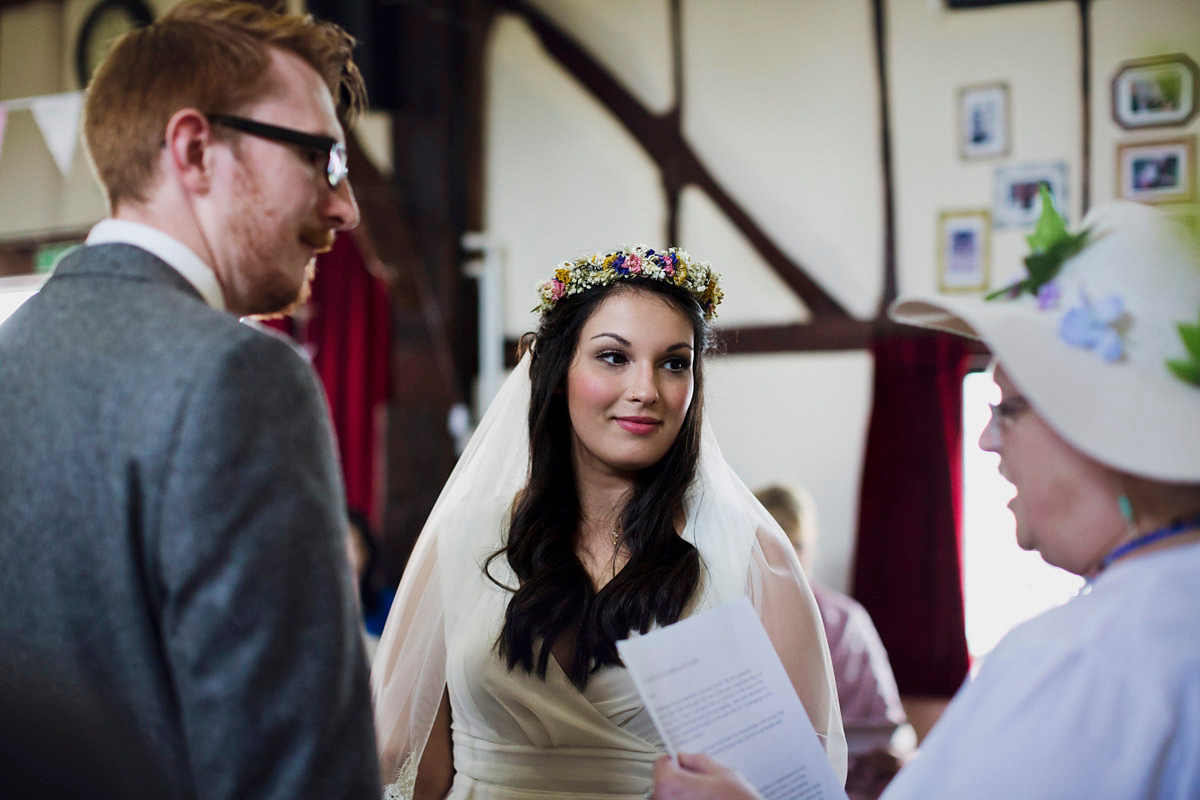 Etsy illustrator Kerris wore an ASOS wedding dress for her boho and handmade village hall wedding. We love the comic book confetti! Photography by Mark Tattersall.