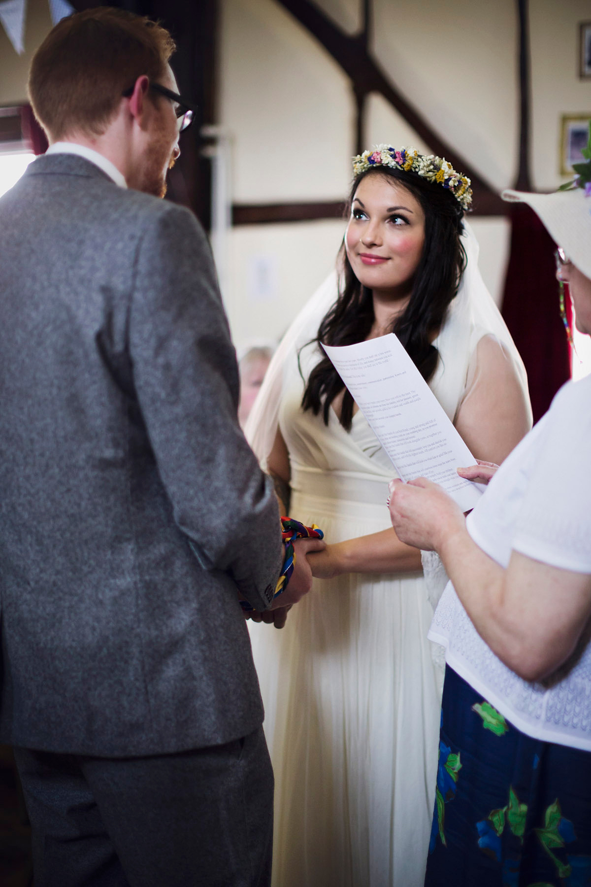 Etsy illustrator Kerris wore an ASOS wedding dress for her boho and handmade village hall wedding. We love the comic book confetti! Photography by Mark Tattersall.