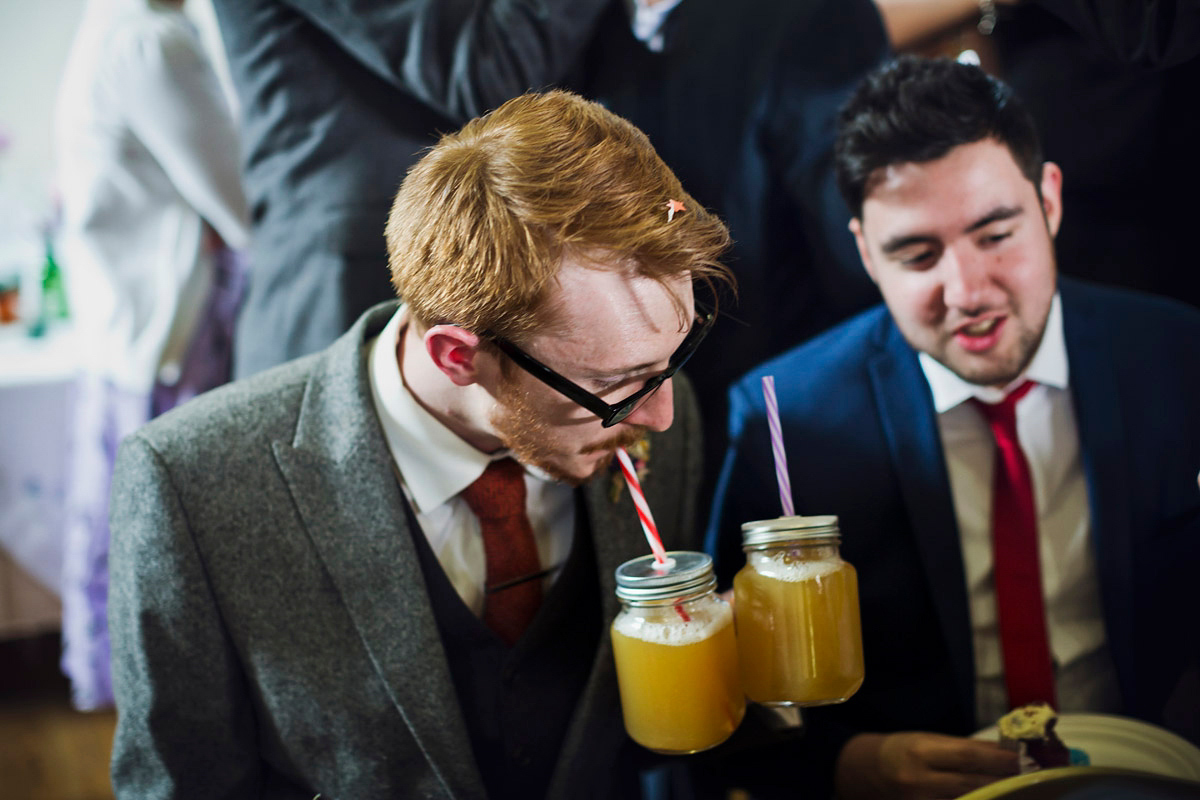 Etsy illustrator Kerris wore an ASOS wedding dress for her boho and handmade village hall wedding. We love the comic book confetti! Photography by Mark Tattersall.